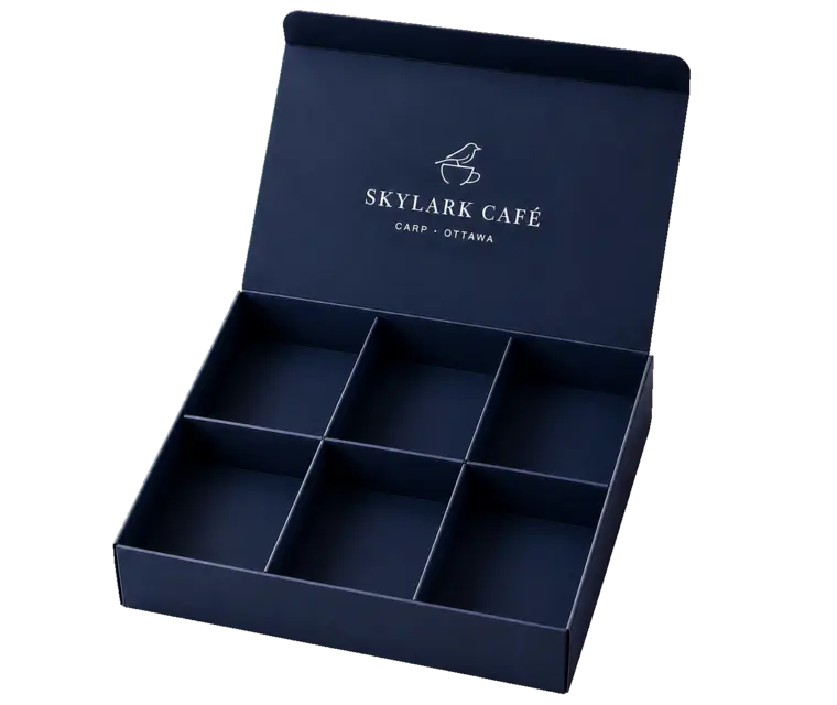 Open navy Skylark Café box divided into six compartments